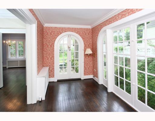 67 Middlesex Road Darien, CT 06820 - Photo 5 of 8 a view of empty room with wooden floor and fan