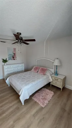 a bedroom with a bed and dresser
