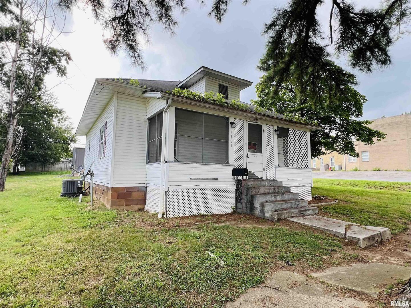 a front view of house with yard and seating area