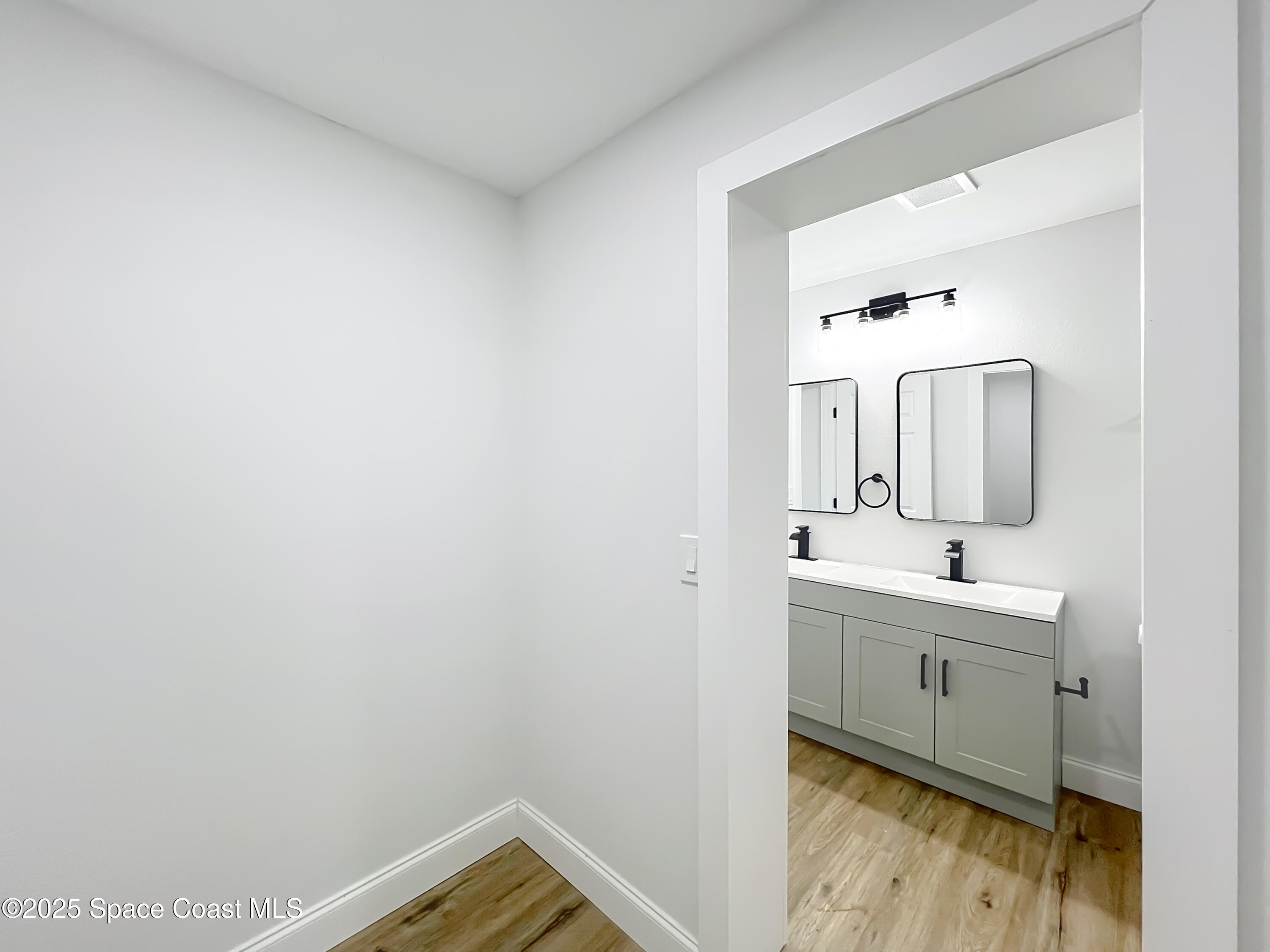 2340 Iowa Drive Melbourne, FL 32935 - Photo 19 of 47 a bathroom with a sink and a mirror