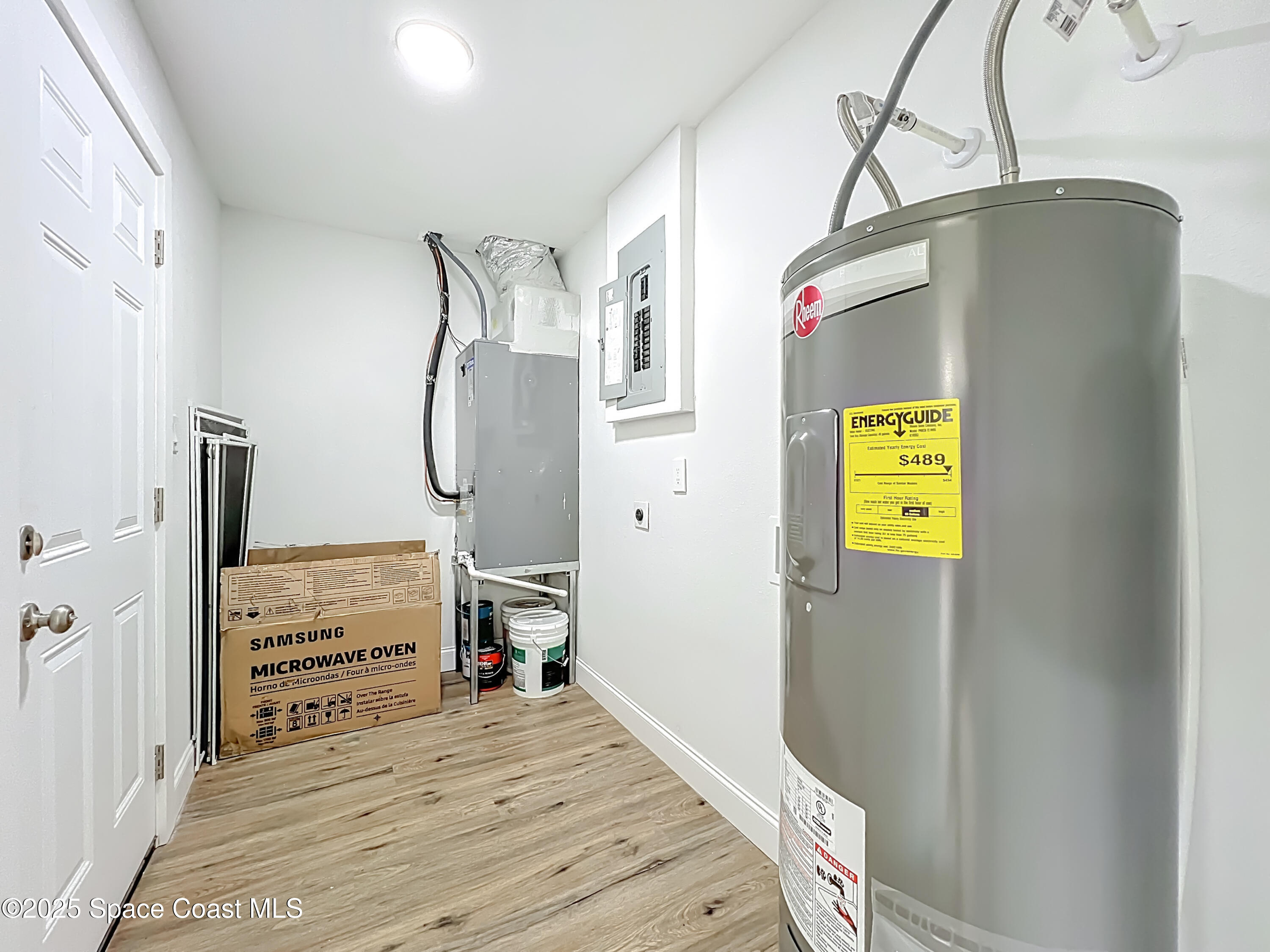 2340 Iowa Drive Melbourne, FL 32935 - Photo 36 of 47 a bedroom with a bed and cabinets