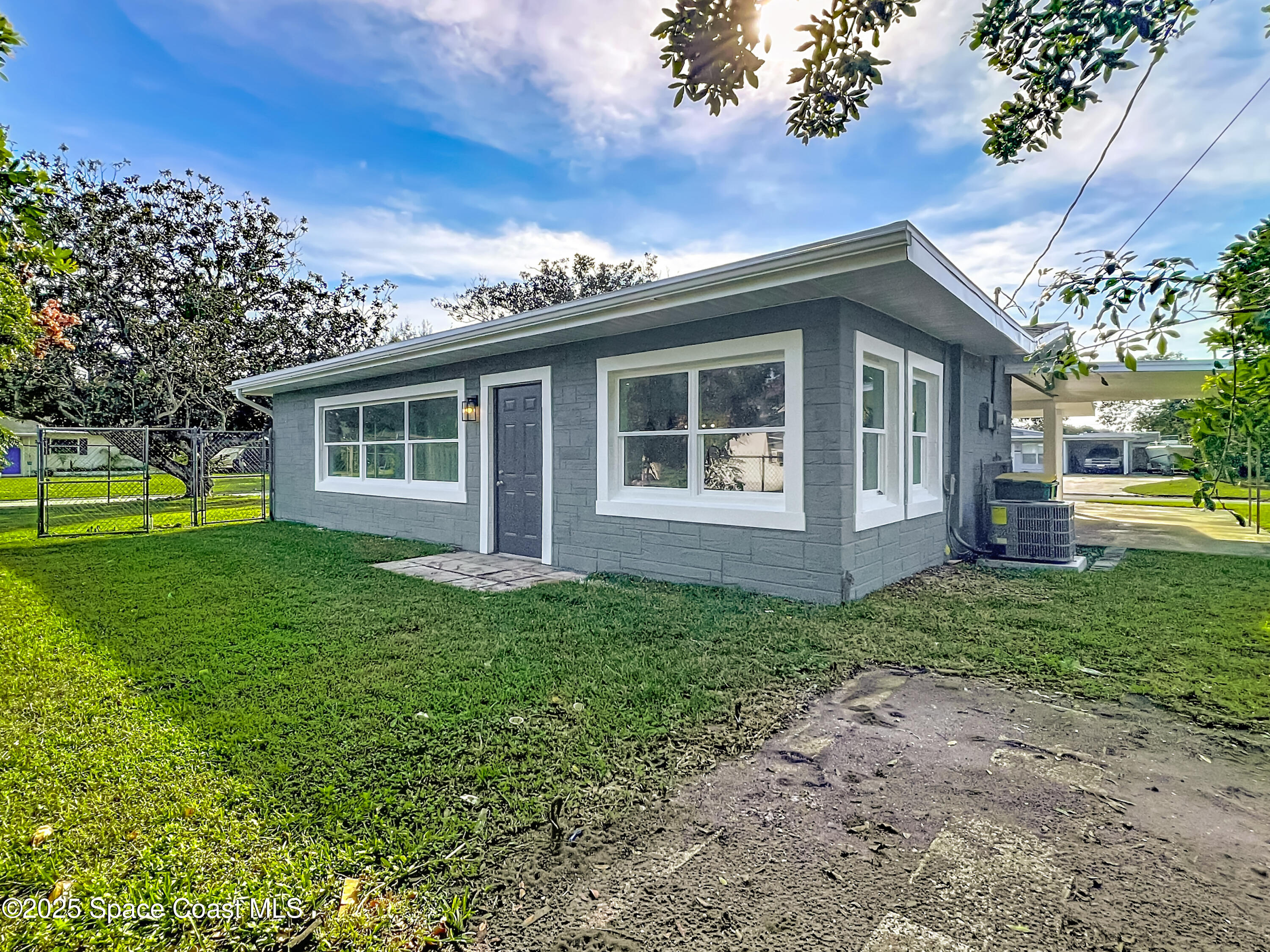 2340 Iowa Drive Melbourne, FL 32935 - Photo 41 of 47 a view of a house with yard and a garden