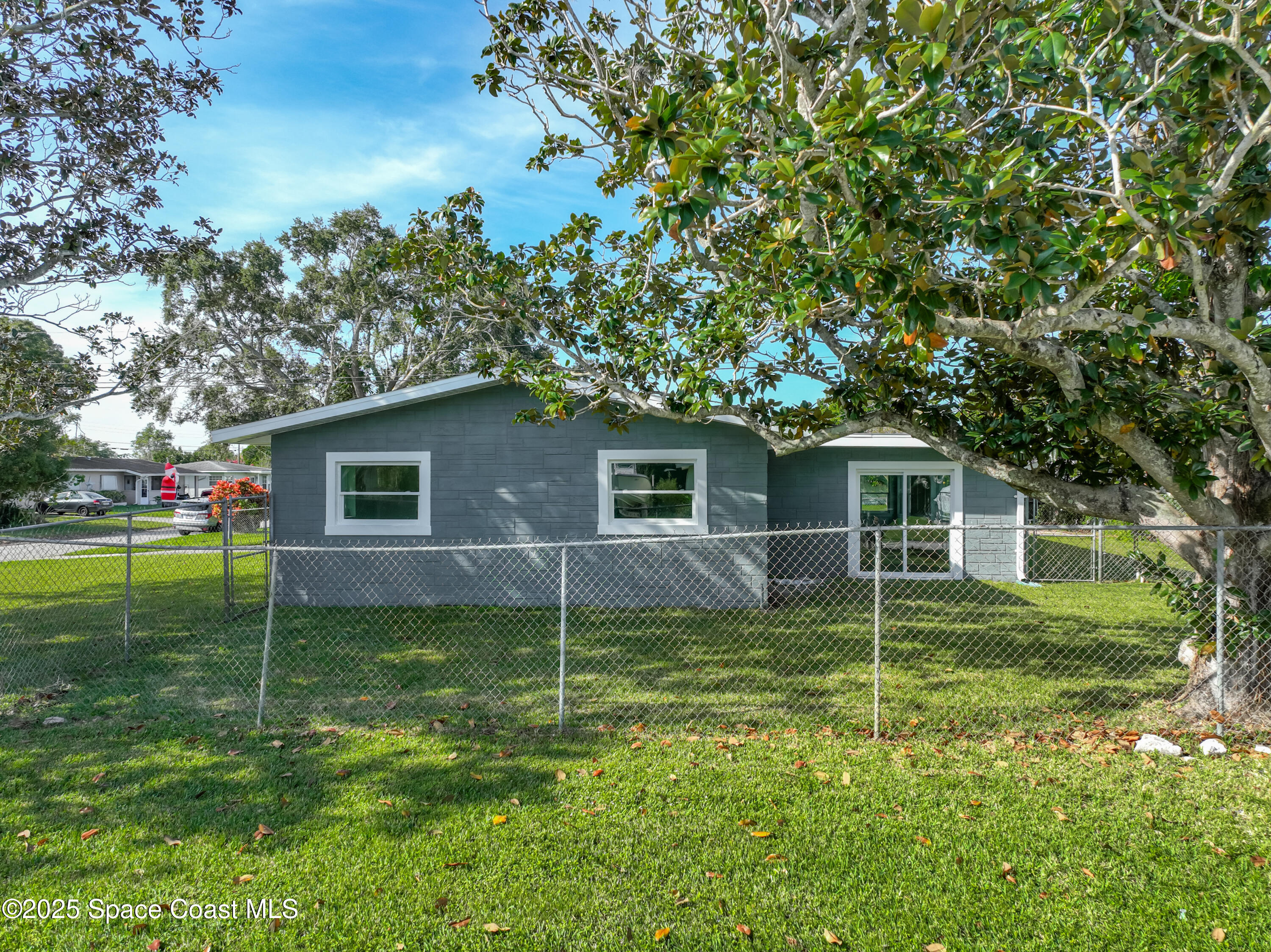 2340 Iowa Drive Melbourne, FL 32935 - Photo 43 of 47 a view of a house with a backyard