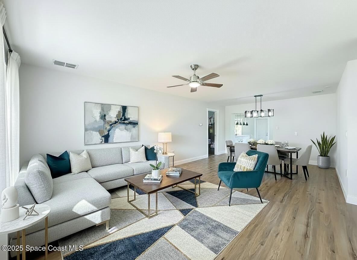 2340 Iowa Drive Melbourne, FL 32935 - Photo 9 of 47 a living room with furniture and wooden floor