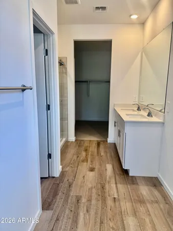 a view of a kitchen with a sink and refrigerator