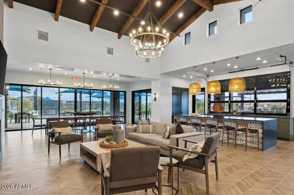 a living room with lots of furniture and a chandelier