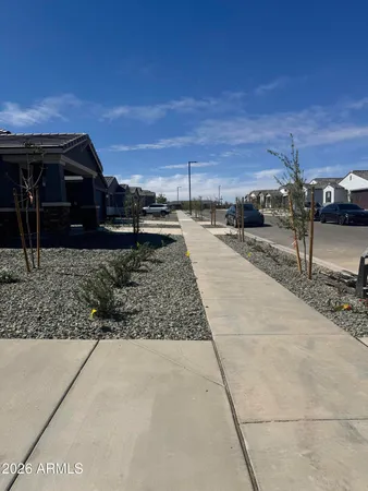 a view of a car park in front of house