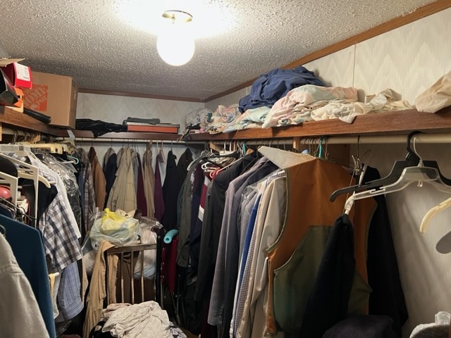 147 Philpot Road Ardmore, TN 38449 - Photo 14 of 21 a view of walk in closet with clothes and shoes