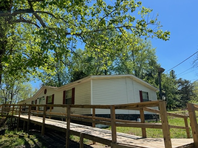 147 Philpot Road Ardmore, TN 38449 - Photo 2 of 21 a front view of a house with a yard