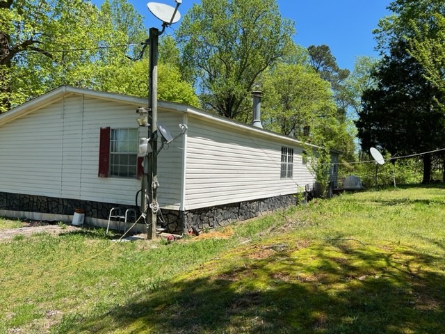 147 Philpot Road Ardmore, TN 38449 - Photo 4 of 21 a backyard of a house with lots of green space