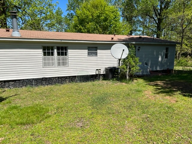 147 Philpot Road Ardmore, TN 38449 - Photo 6 of 21 a view of a house with a backyard