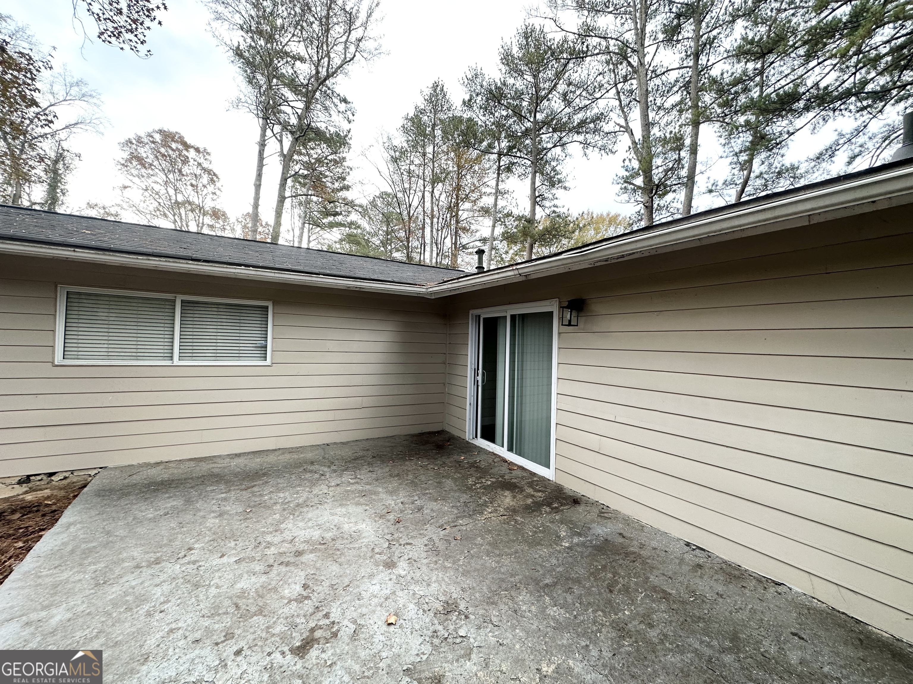 310 Flagstone Drive Southwest Atlanta, GA 30331 - Photo 13 of 13 a side view of a house with a tree