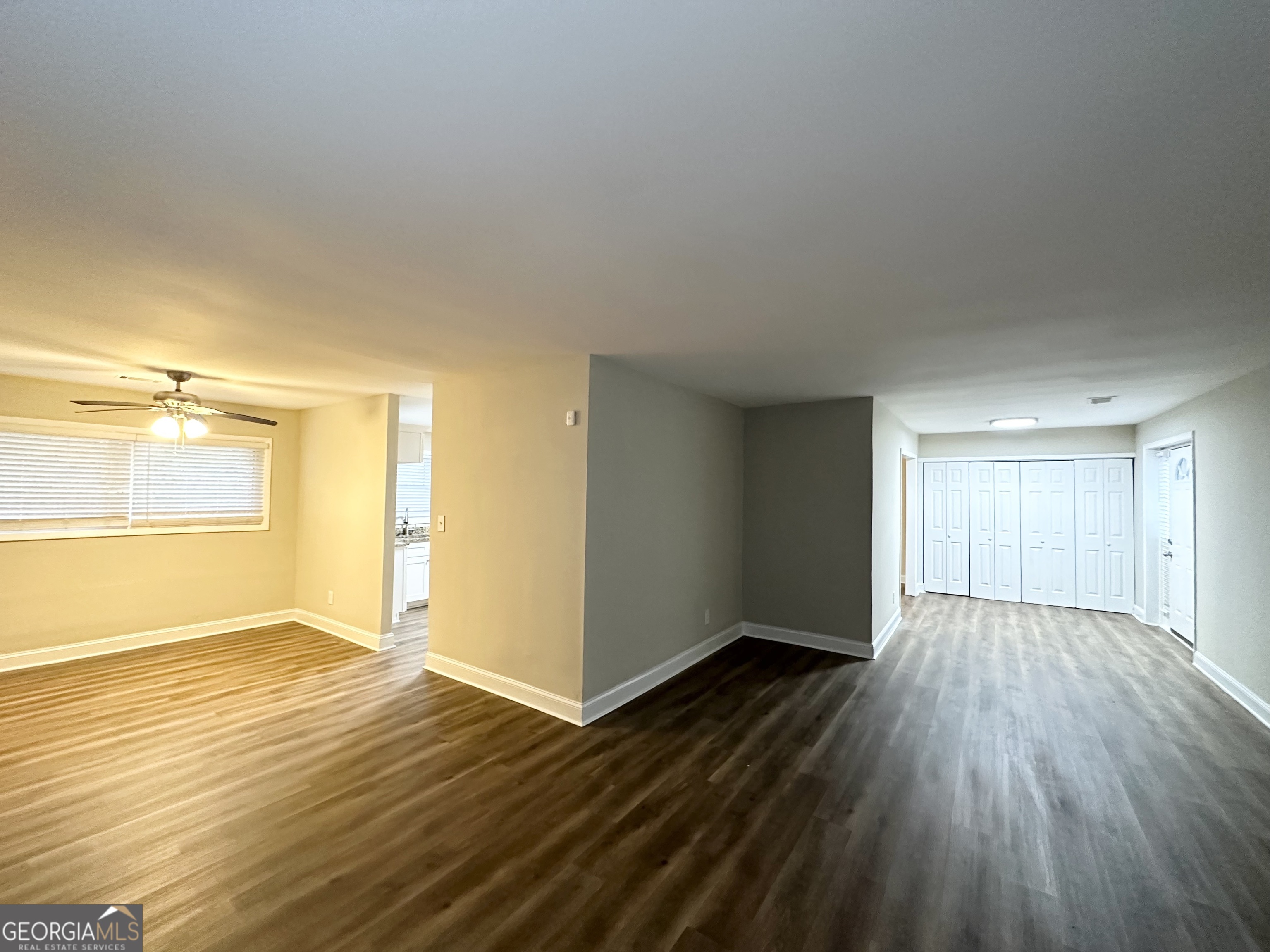 310 Flagstone Drive Southwest Atlanta, GA 30331 - Photo 4 of 13 an empty room with wooden floor and windows