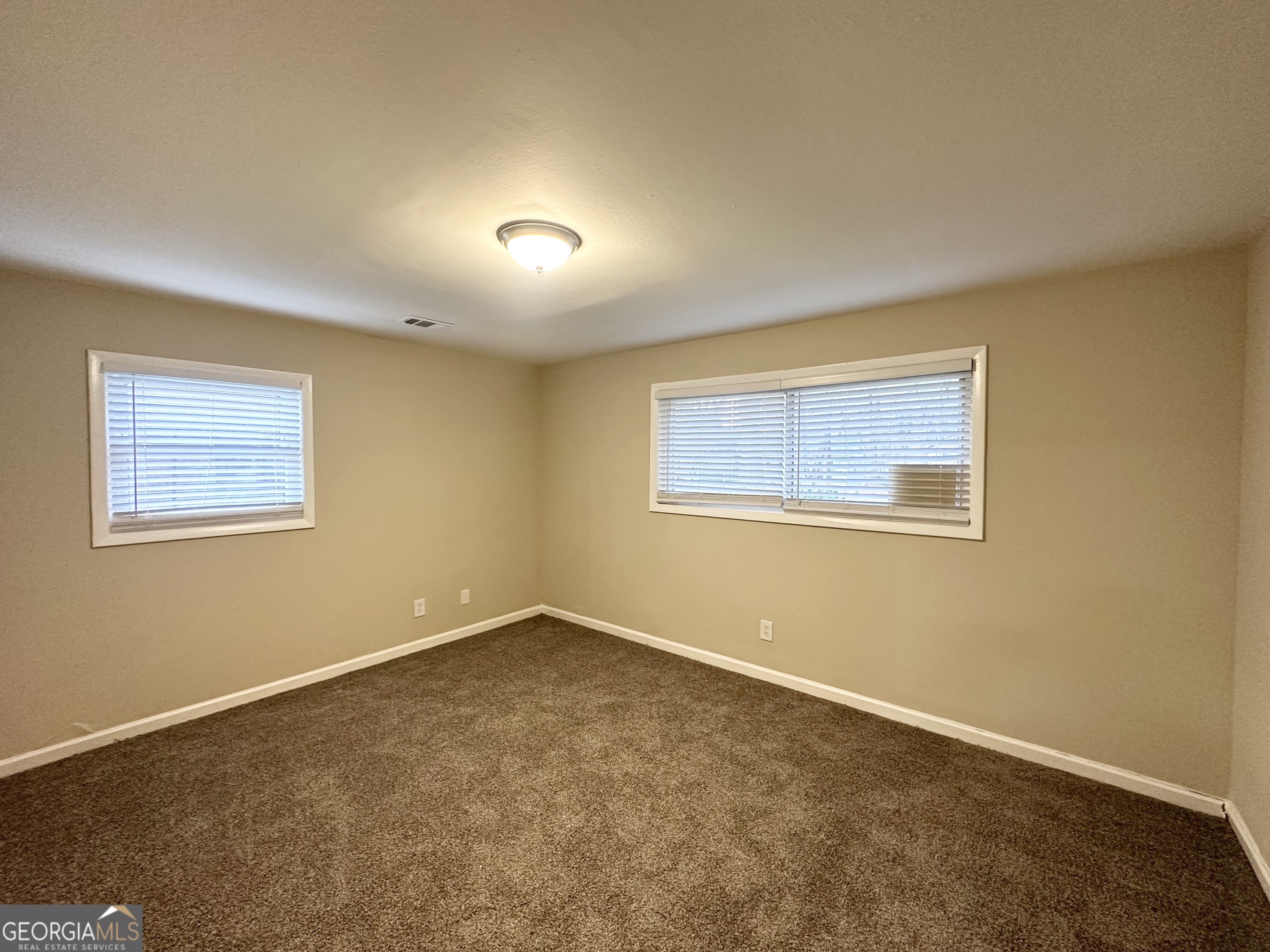 310 Flagstone Drive Southwest Atlanta, GA 30331 - Photo 7 of 13 a view of an empty room with a window