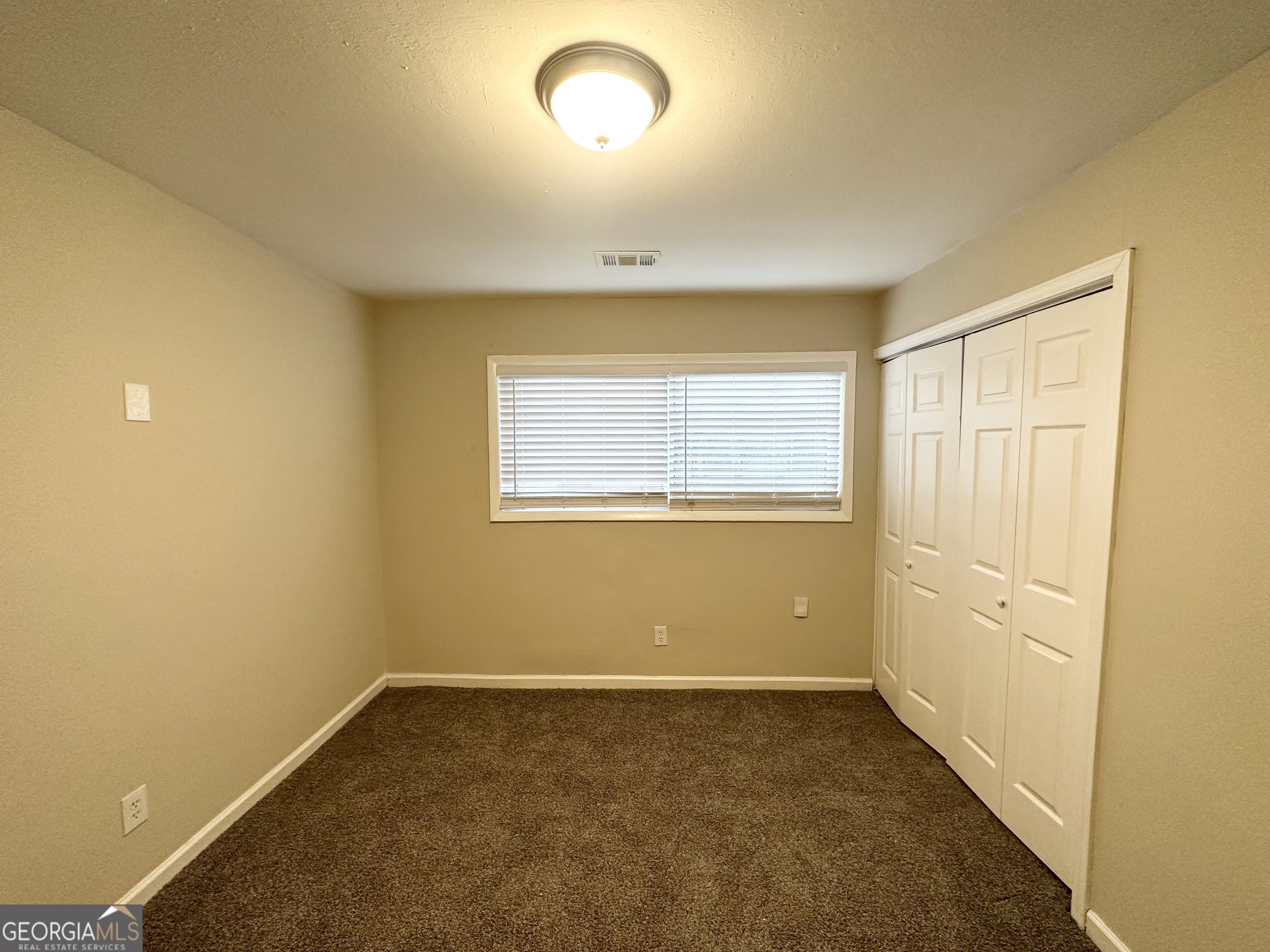 310 Flagstone Drive Southwest Atlanta, GA 30331 - Photo 8 of 13 an empty room with a empty space and windows