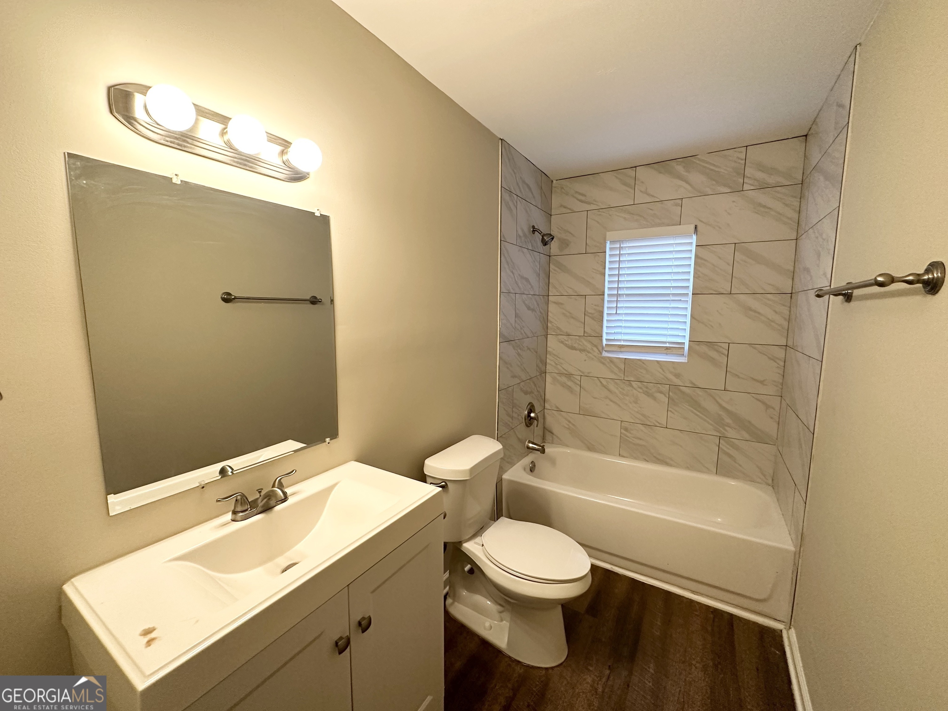 310 Flagstone Drive Southwest Atlanta, GA 30331 - Photo 9 of 13 a bathroom with a bathtub shower sink vanity and toilet
