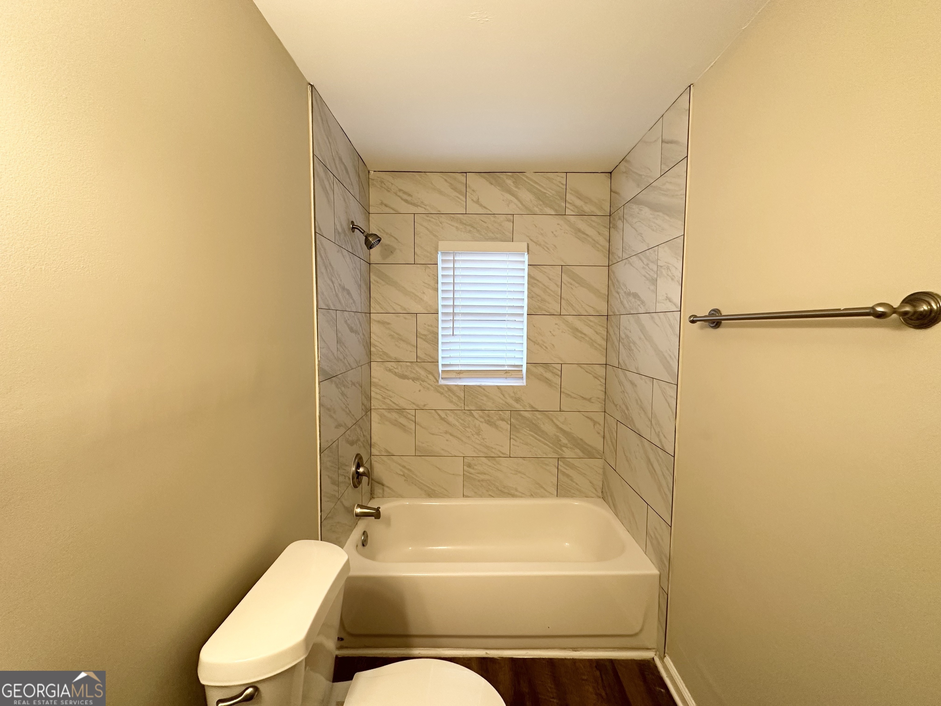 310 Flagstone Drive Southwest Atlanta, GA 30331 - Photo 10 of 13 a bathroom with a toilet and bathtub