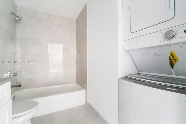 a bathroom with a tub and a shower