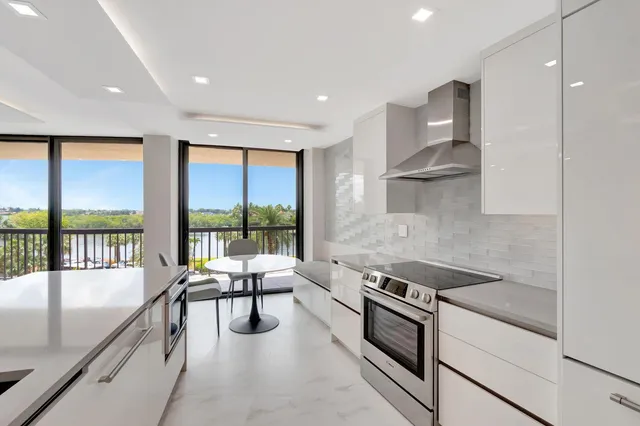 a large bathroom with a glass shower door and a bathtub