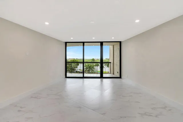 a view of a house with yard and lake view