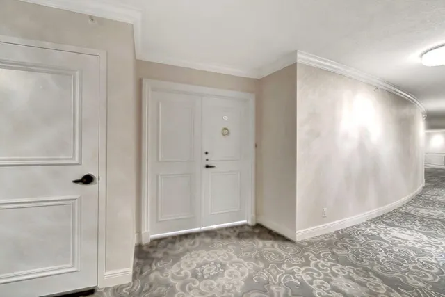 a bedroom with a large bed and a large window