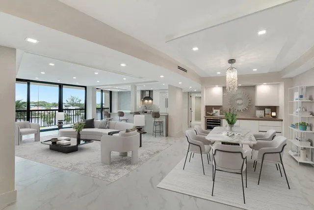 a spacious bedroom with a bed and a large window