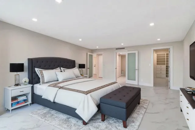 a bathroom with a shower and a glass door