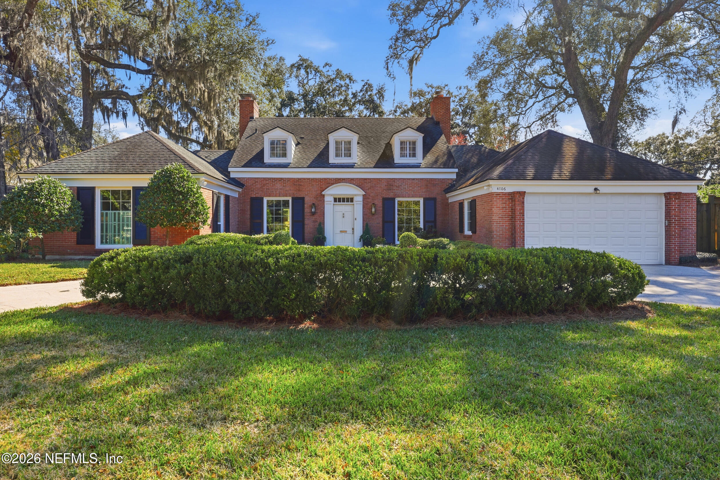 4706 Ivanhoe Road Jacksonville, FL 32210 - Photo 1 of 47 a front view of a house with a garden