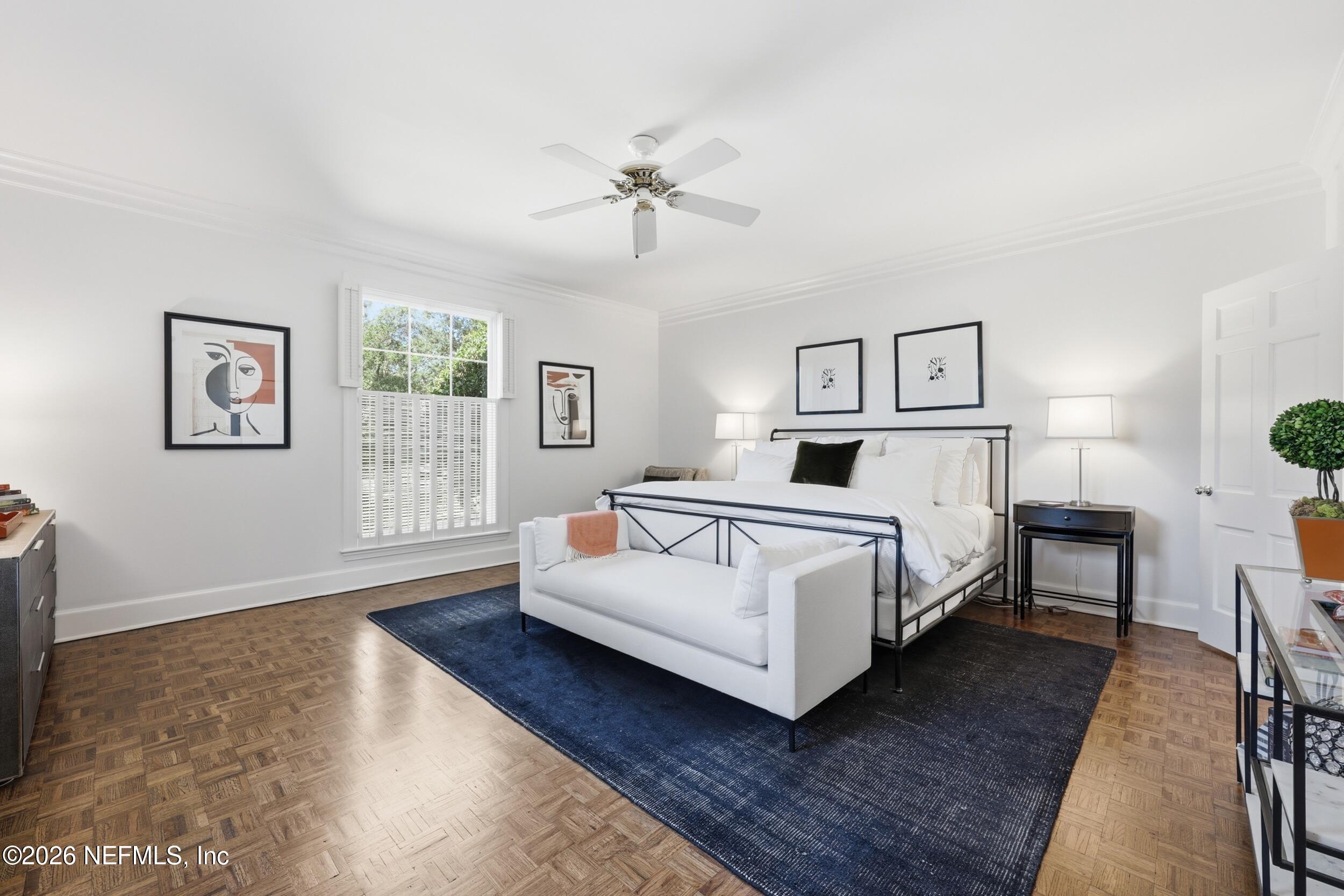 4706 Ivanhoe Road Jacksonville, FL 32210 - Photo 20 of 47 a bedroom with a white bed and a couch