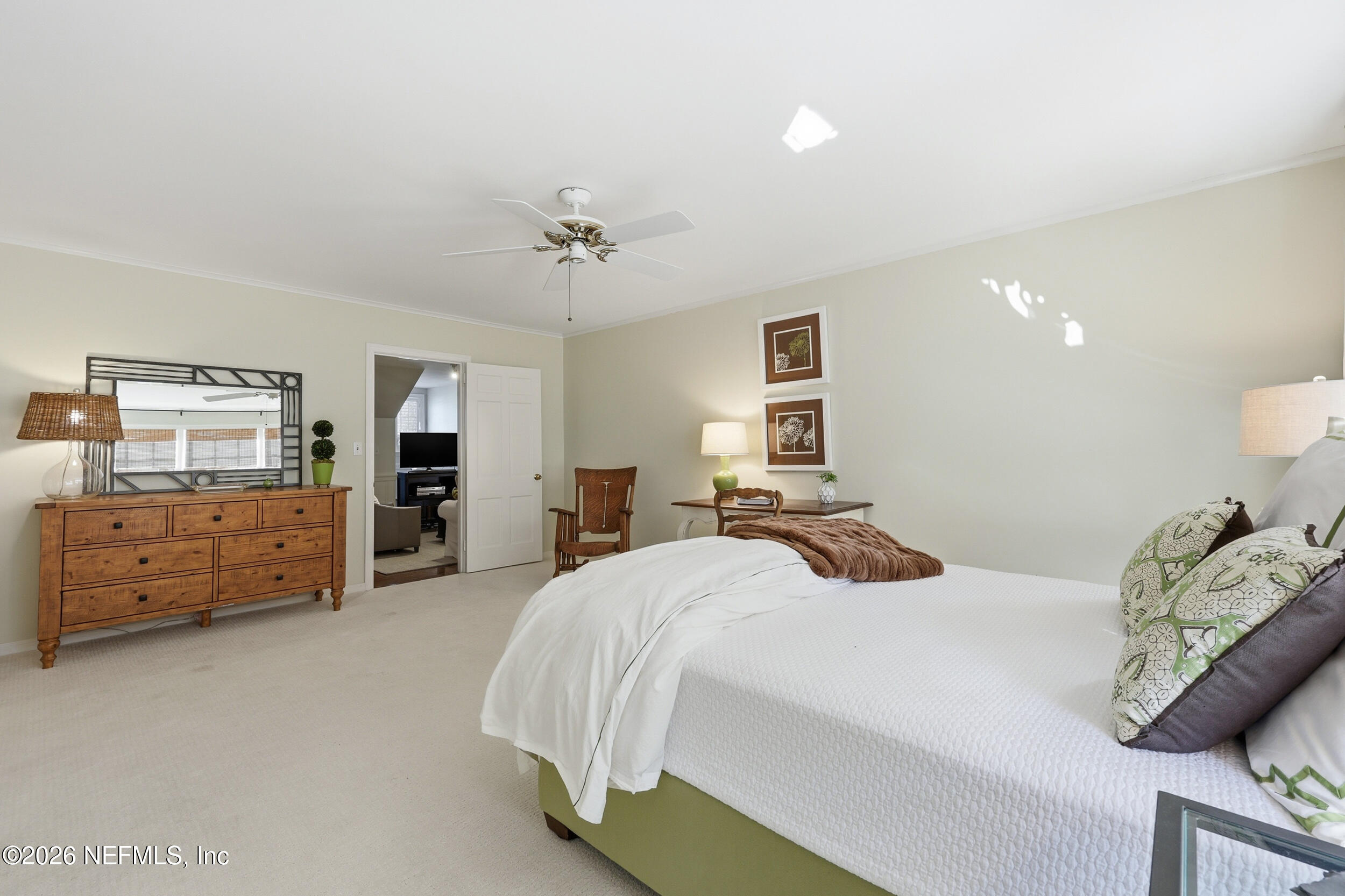 4706 Ivanhoe Road Jacksonville, FL 32210 - Photo 33 of 47 a bedroom with a bed and dresser