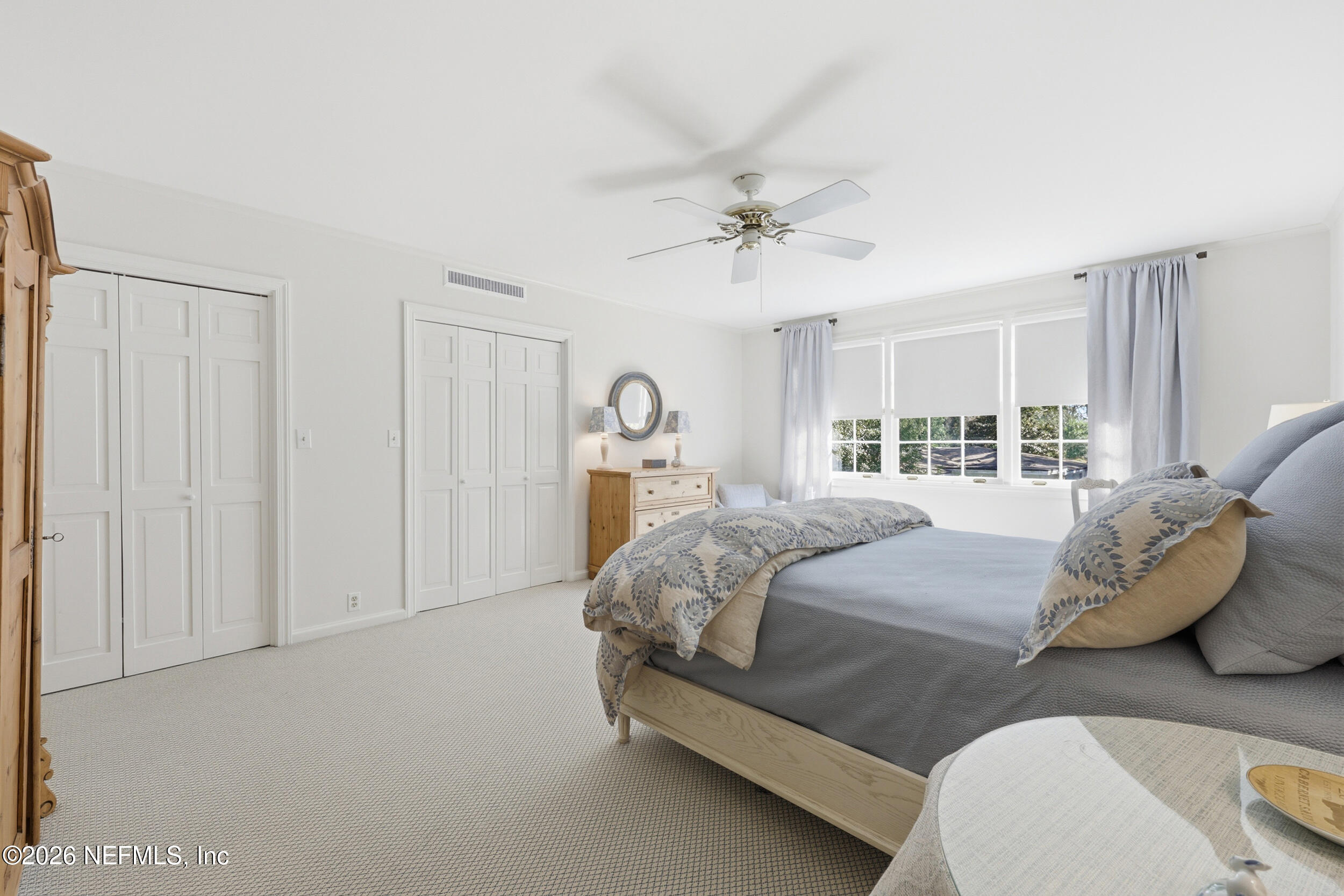 4706 Ivanhoe Road Jacksonville, FL 32210 - Photo 34 of 47 a bedroom with a bed and window