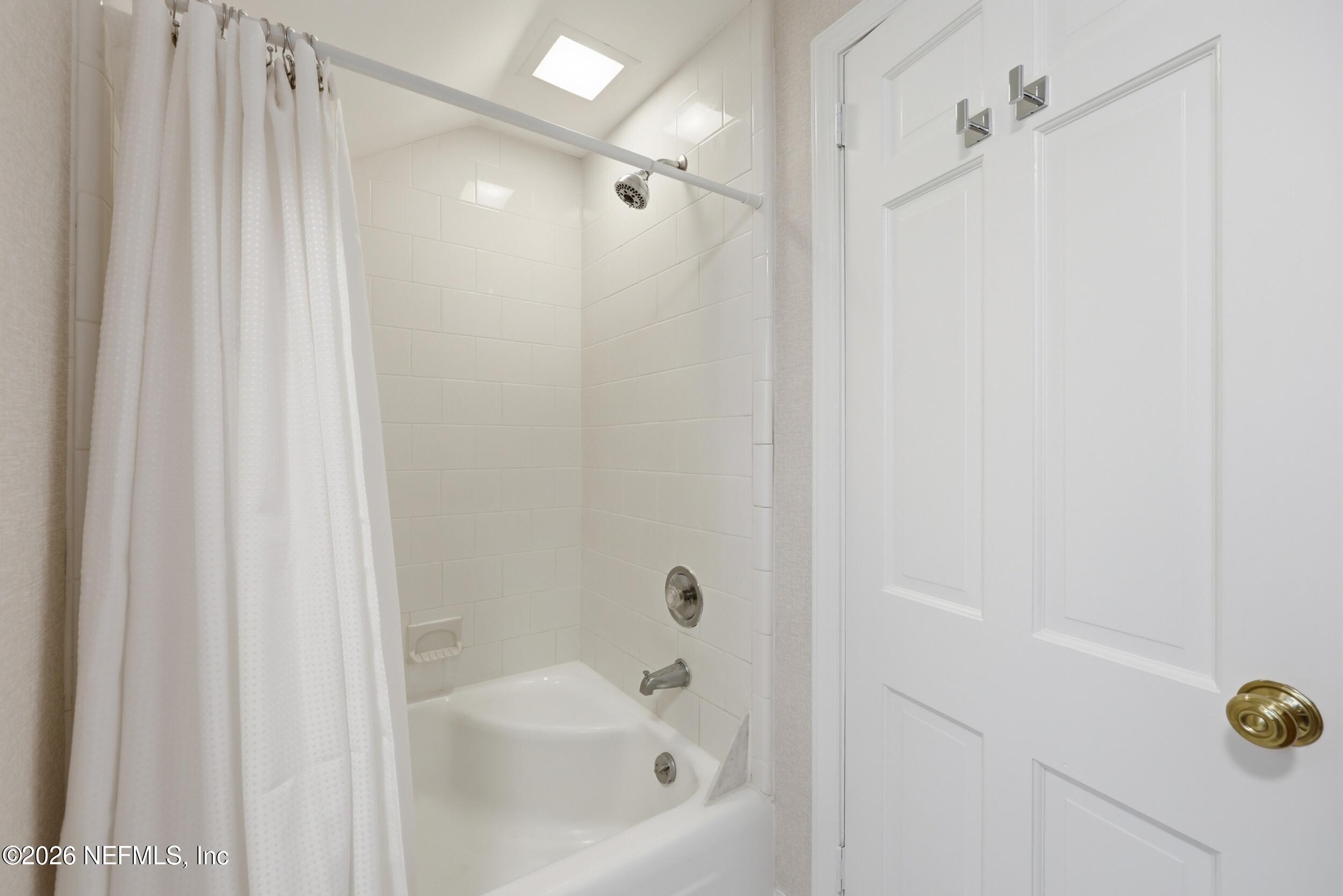 4706 Ivanhoe Road Jacksonville, FL 32210 - Photo 37 of 47 a bathroom with a shower and a shower