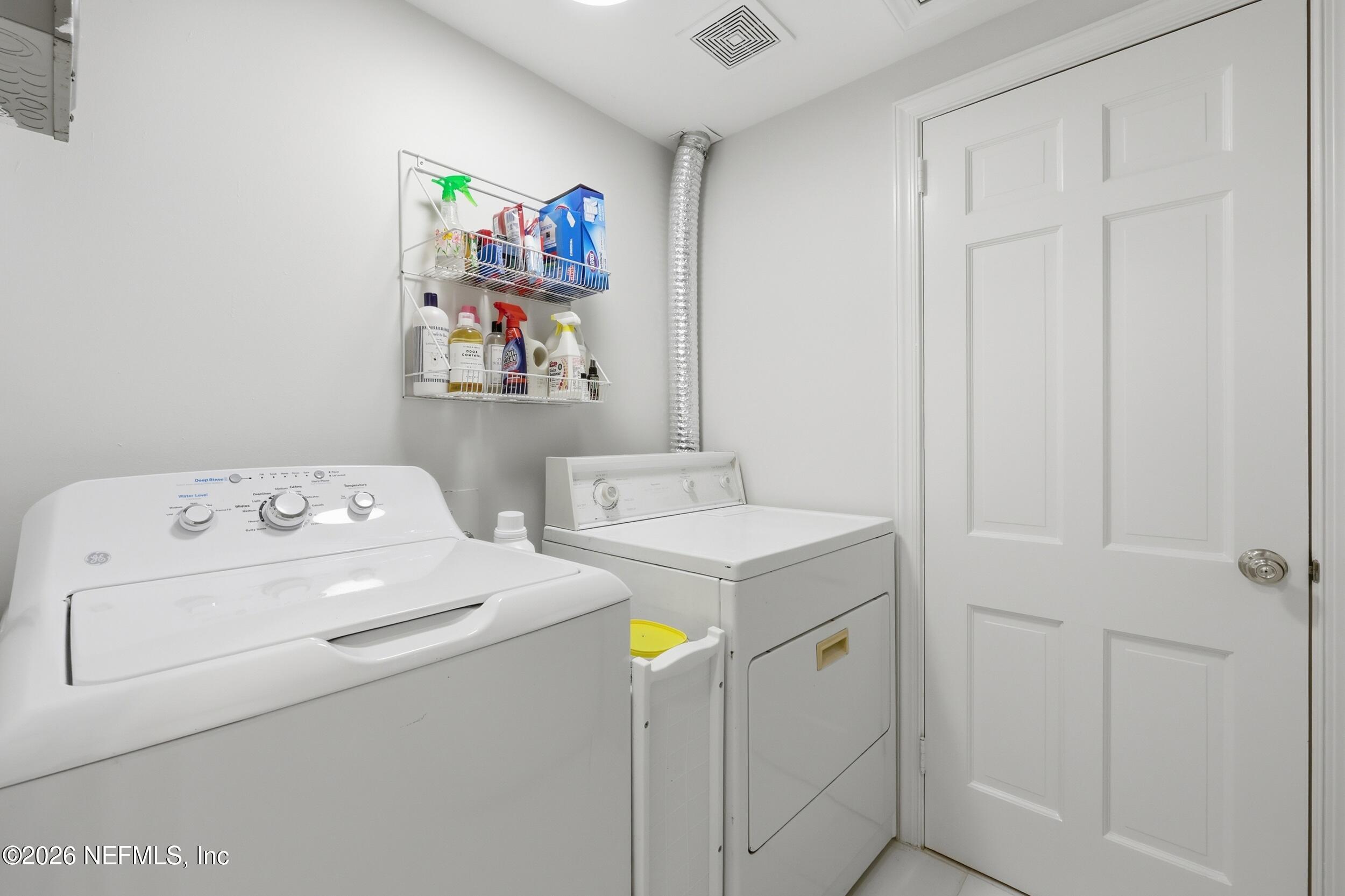 4706 Ivanhoe Road Jacksonville, FL 32210 - Photo 45 of 47 a utility room with dryer and washer