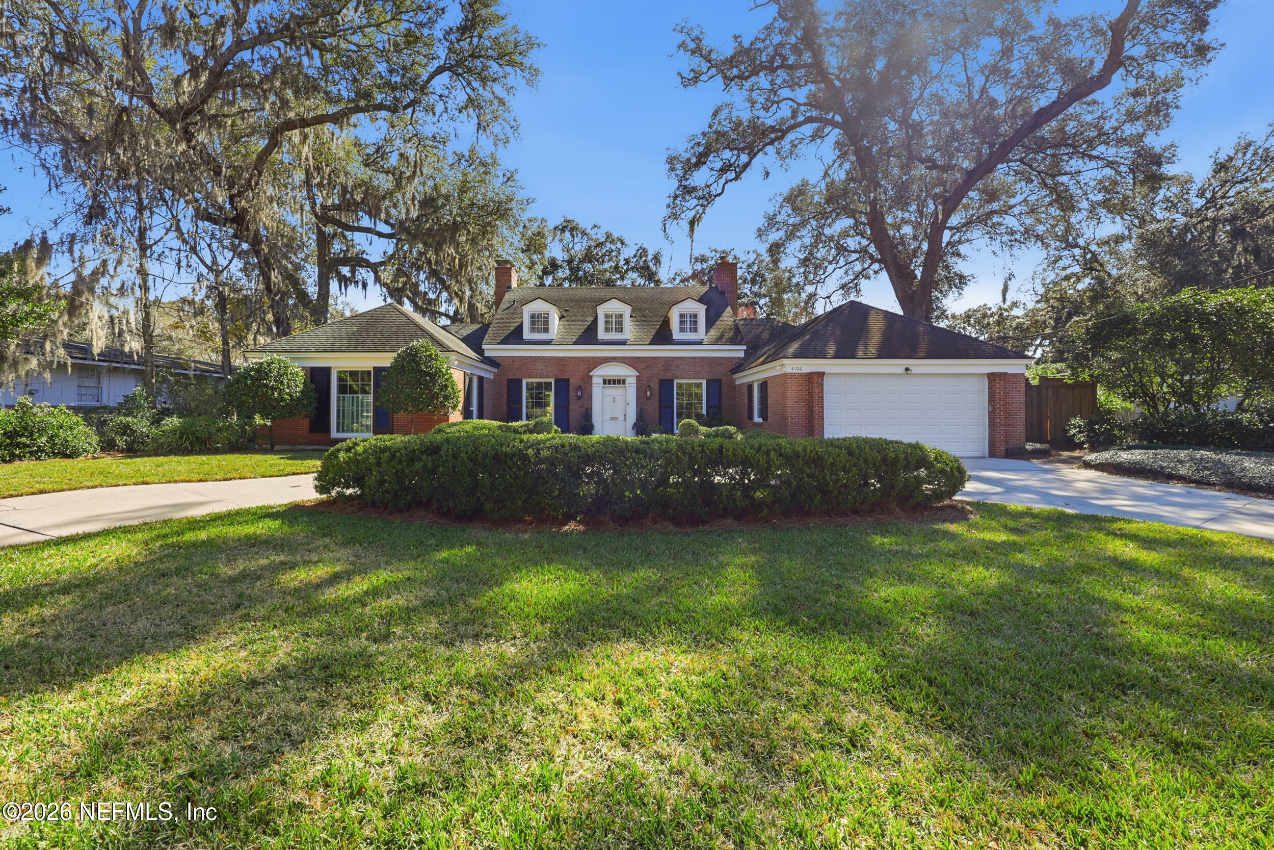 4706 Ivanhoe Road Jacksonville, FL 32210 - Photo 47 of 47 a front view of a house with a garden and yard