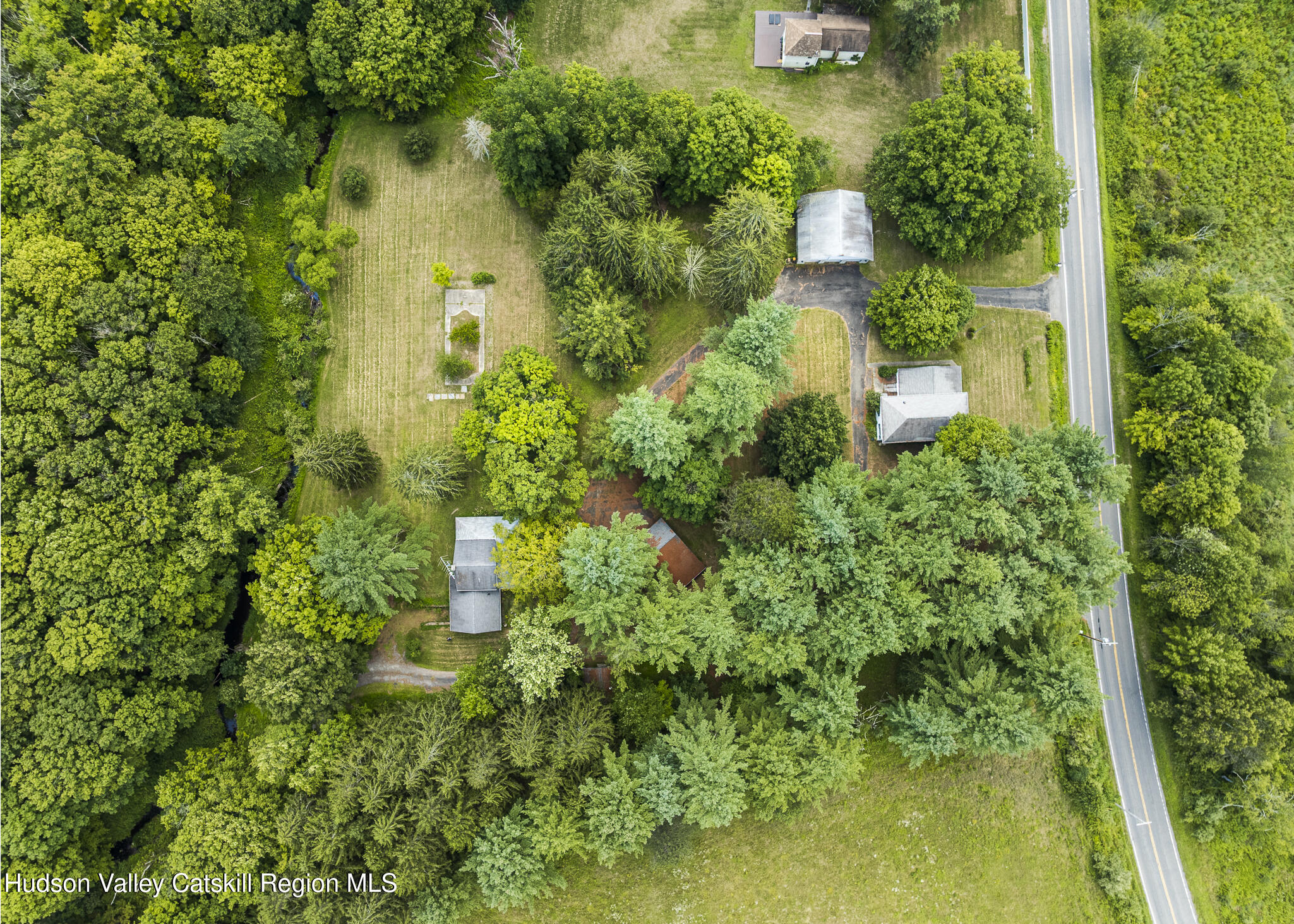 174 Co Rte 11 Pine Plains, NY 12567 - Photo 1 of 37 an aerial view of residential house with outdoor space and trees all around