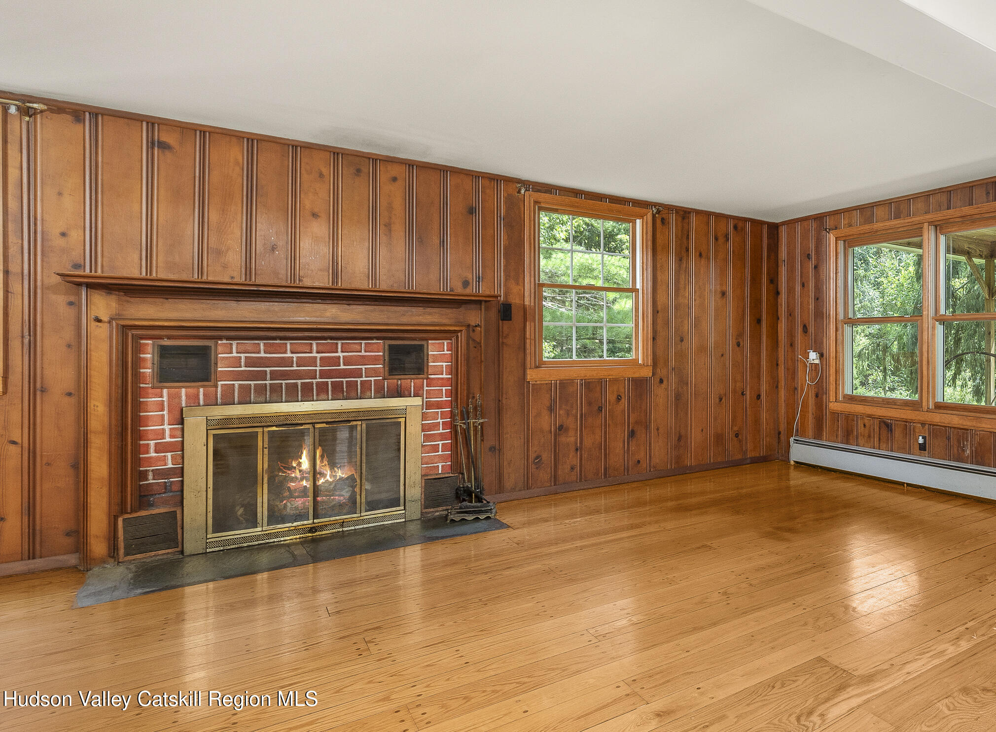 174 Co Rte 11 Pine Plains, NY 12567 - Photo 12 of 37 an empty room with windows fire place and a fireplace