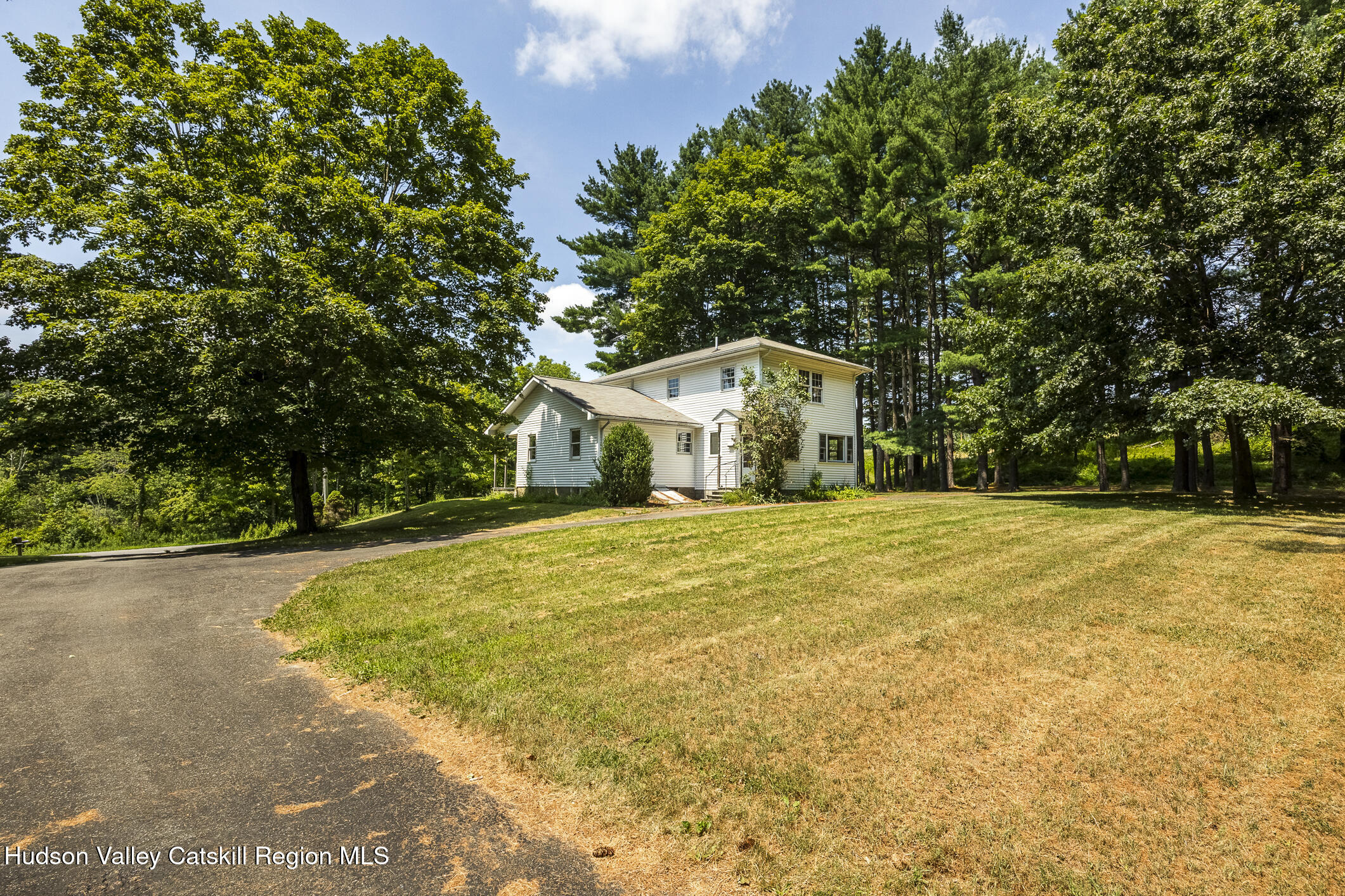 174 Co Rte 11 Pine Plains, NY 12567 - Photo 18 of 37 a house with trees in front of it