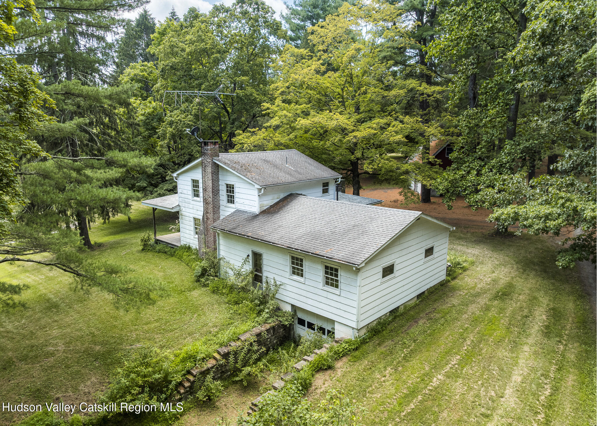 174 Co Rte 11 Pine Plains, NY 12567 - Photo 20 of 37 an aerial view of a house with swimming pool and large trees