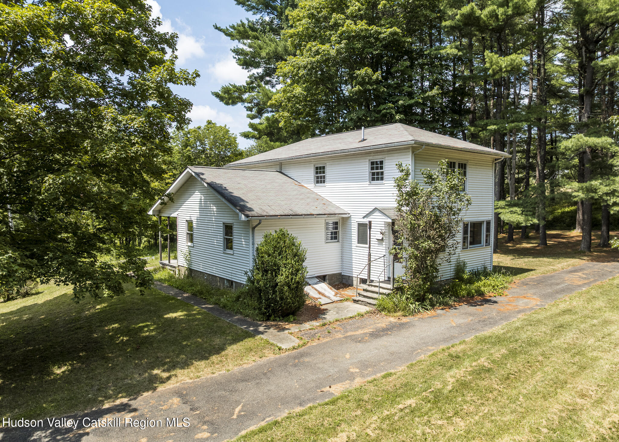 174 Co Rte 11 Pine Plains, NY 12567 - Photo 21 of 37 a front view of a house with a yard