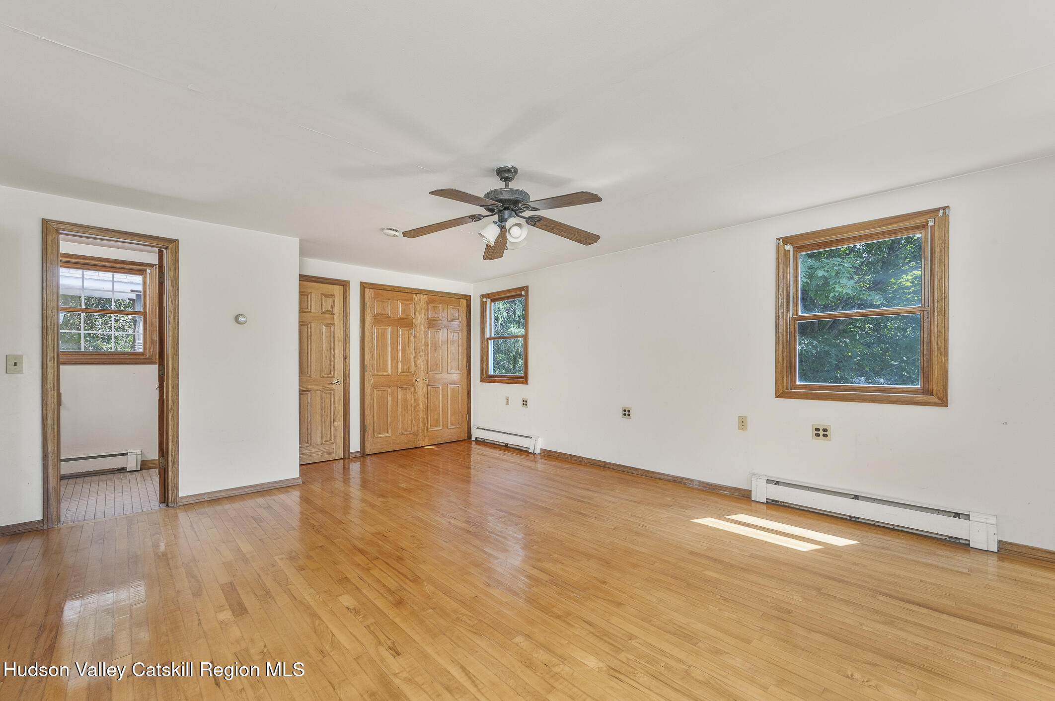 174 Co Rte 11 Pine Plains, NY 12567 - Photo 28 of 37 a view of an empty room with window and wooden floor