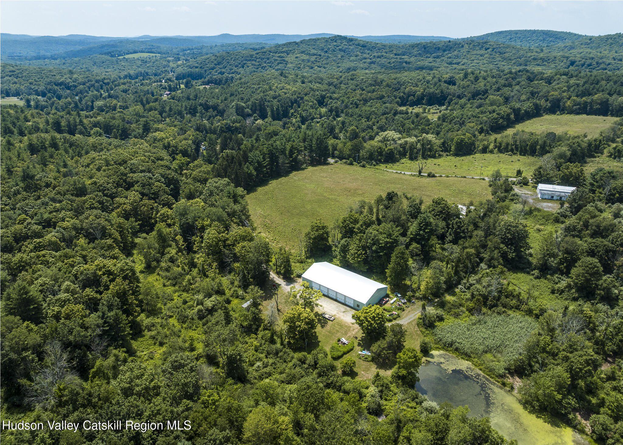 174 Co Rte 11 Pine Plains, NY 12567 - Photo 3 of 37 an aerial view of a house with a yard
