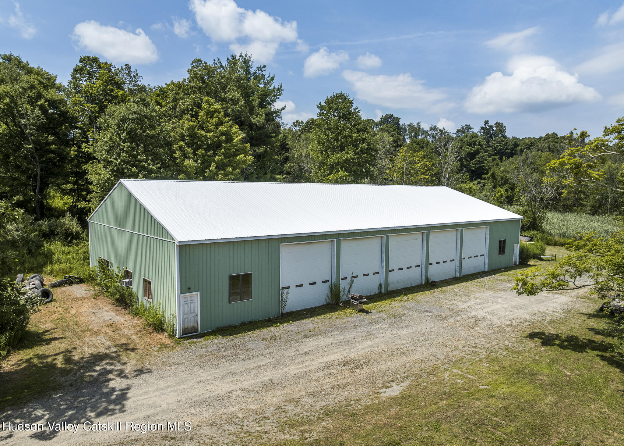174 Co Rte 11 Pine Plains, NY 12567 - Photo 32 of 37 a front view of a house with a yard and garage