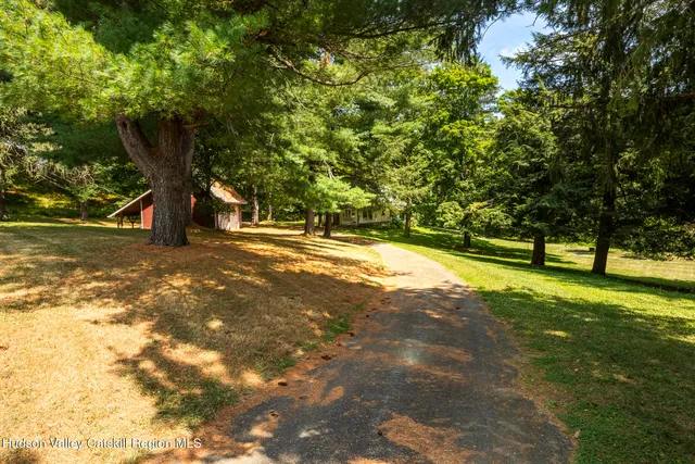 a kitchen with stainless steel appliances granite countertop a sink counter space and wooden floor