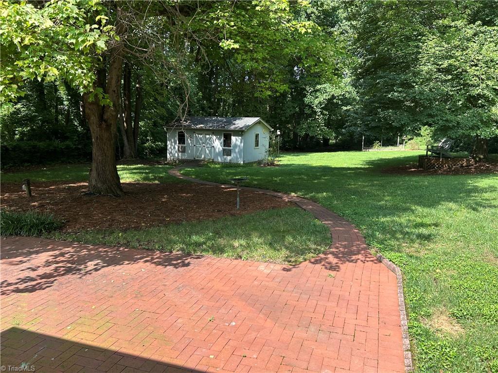 2911 Pleasant Ridge Road Summerfield, NC 27358 - Photo 13 of 47 Patio looking over private back yard
