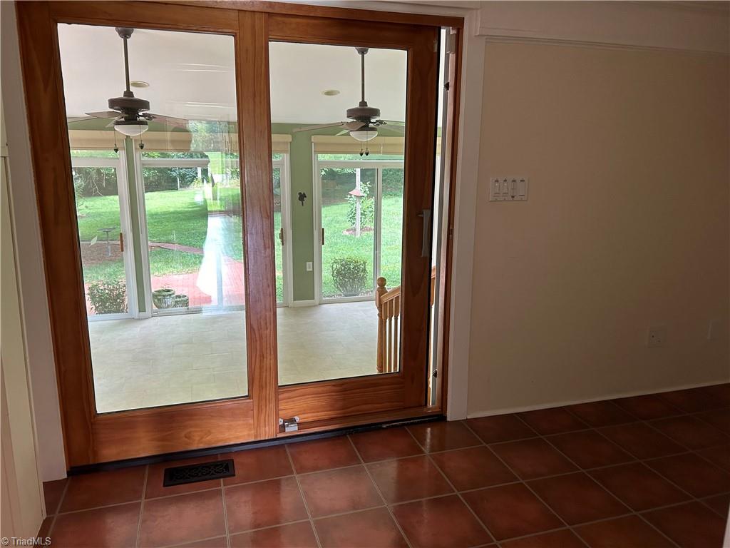 2911 Pleasant Ridge Road Summerfield, NC 27358 - Photo 19 of 47 Sliding Doors out to sun room
