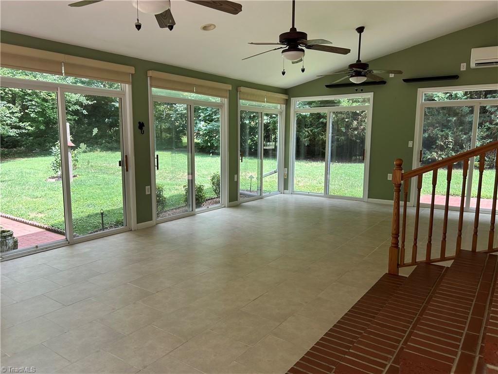 2911 Pleasant Ridge Road Summerfield, NC 27358 - Photo 20 of 47 Steps down to sun room