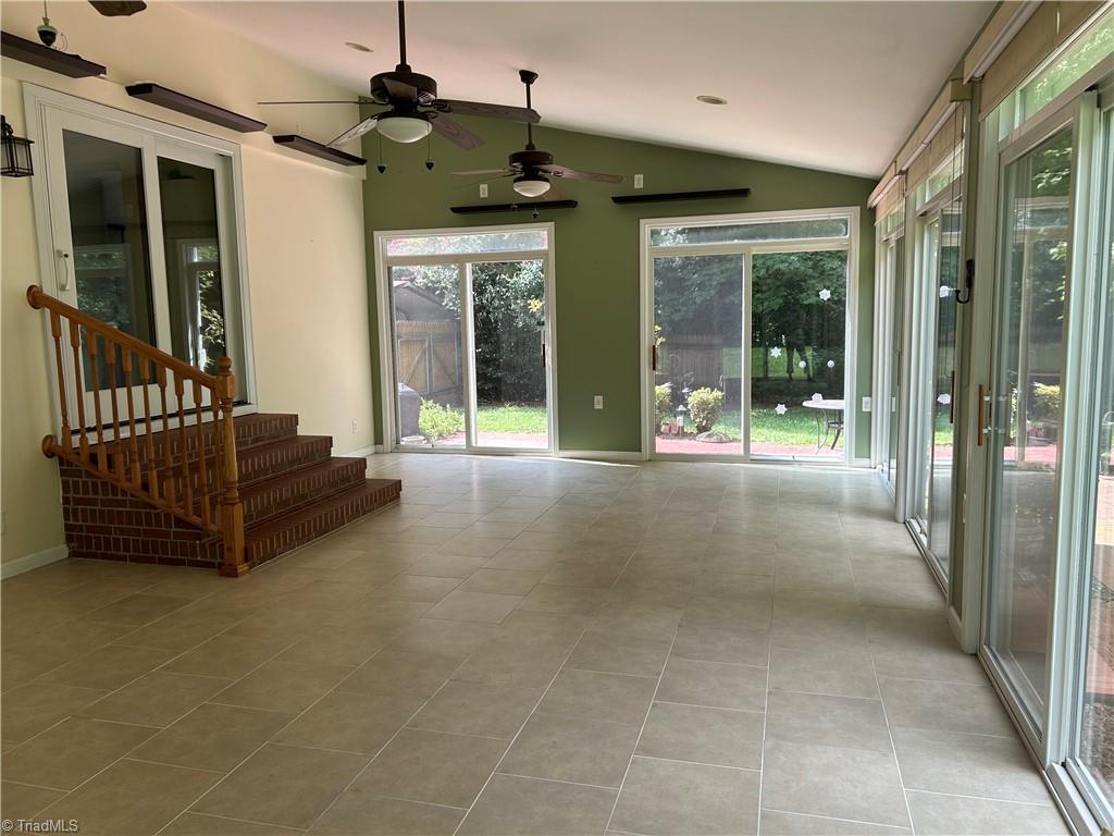 2911 Pleasant Ridge Road Summerfield, NC 27358 - Photo 22 of 47 Spacious tiled sunroom