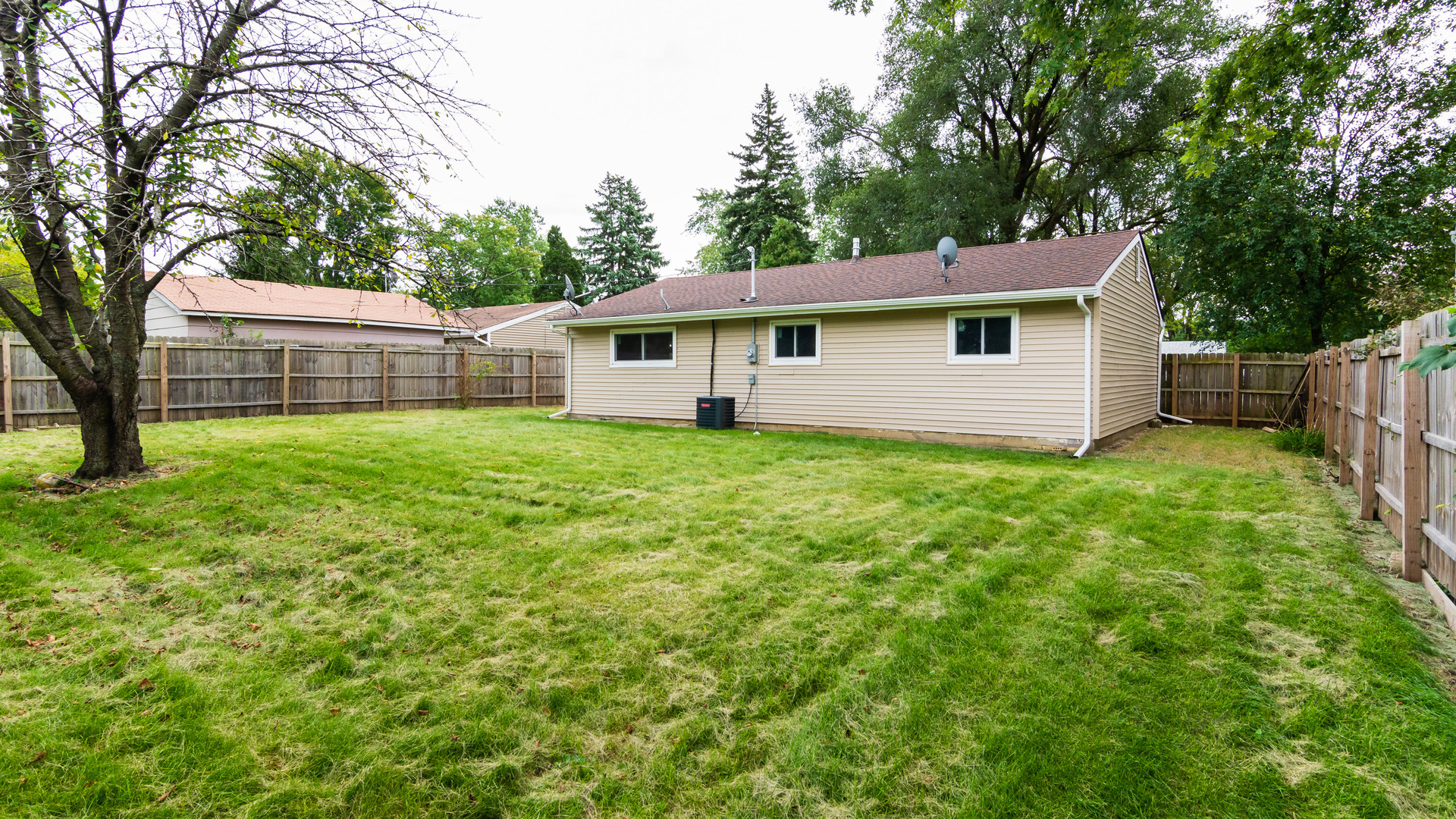 187 Queenswood Road Bolingbrook, IL 60440 - Photo 11 of 36 a view of a house with a yard