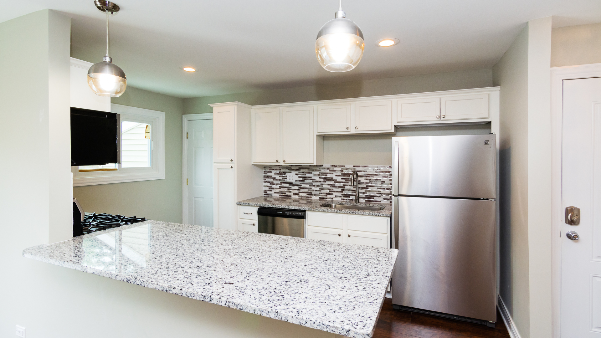 187 Queenswood Road Bolingbrook, IL 60440 - Photo 14 of 36 a kitchen with a refrigerator and a stove top oven