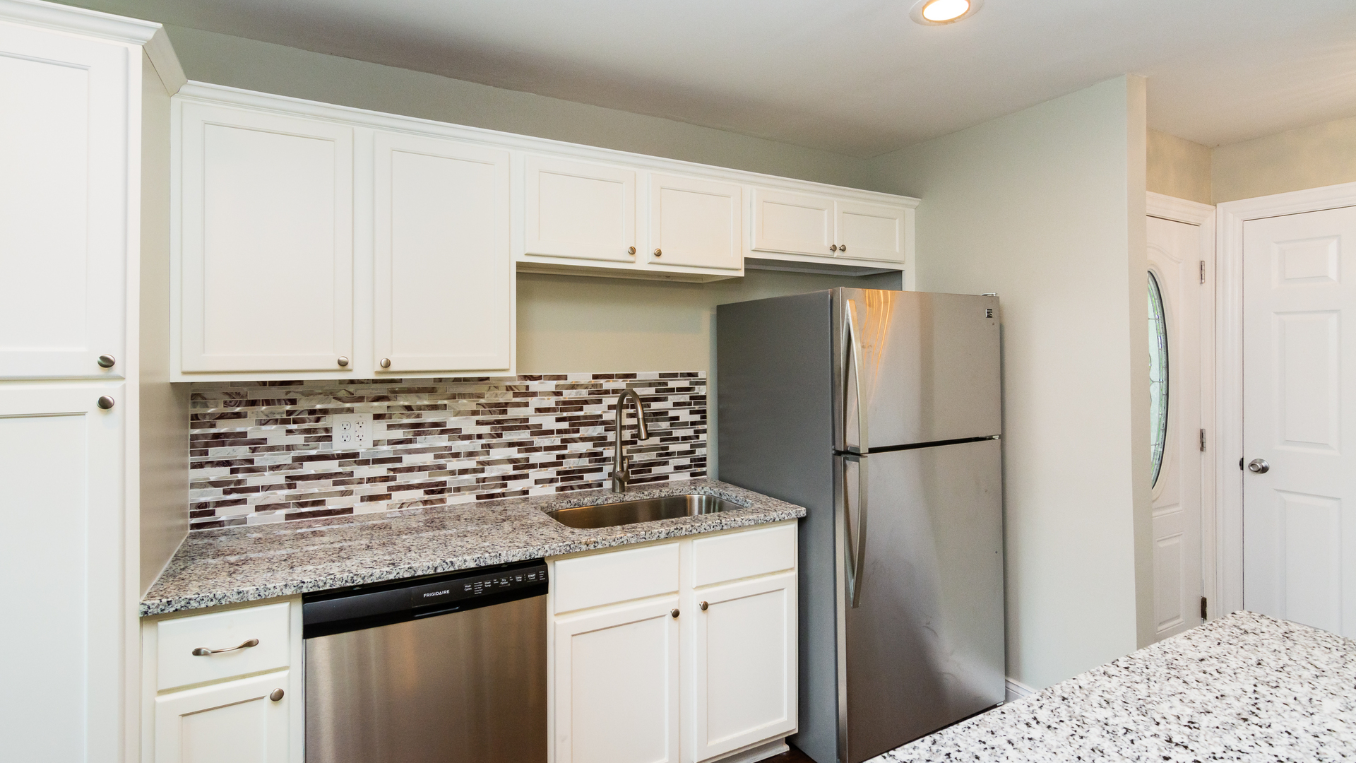 187 Queenswood Road Bolingbrook, IL 60440 - Photo 17 of 36 a kitchen with refrigerator and cabinets